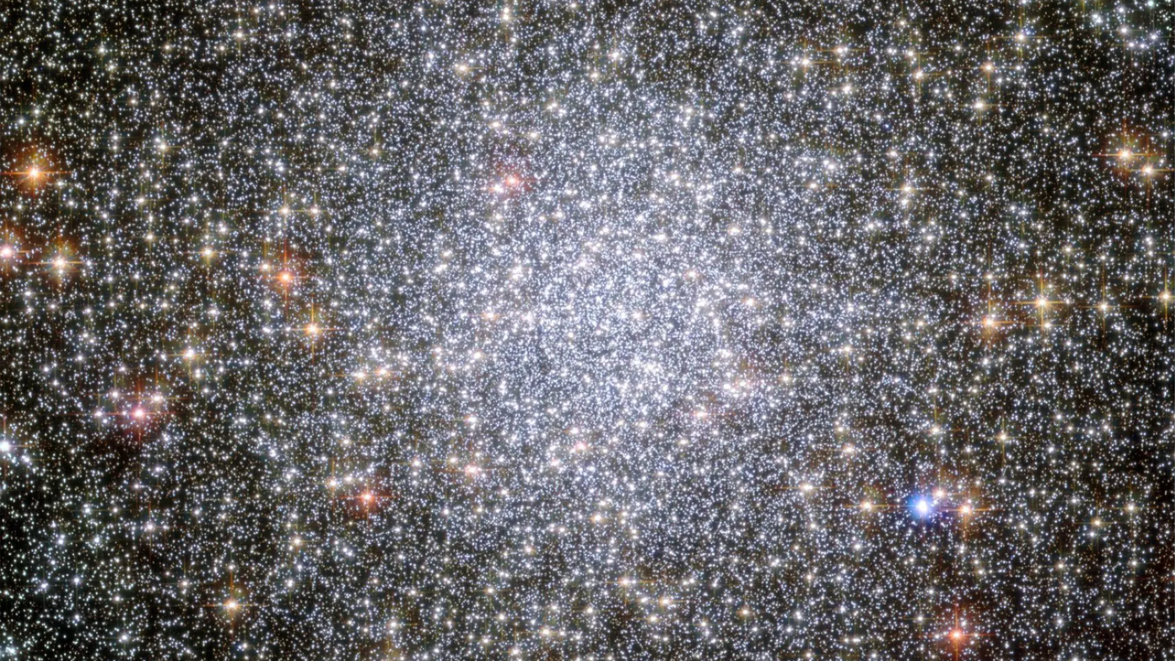 A cluster of stars, glowing brightly in the centre of the image.