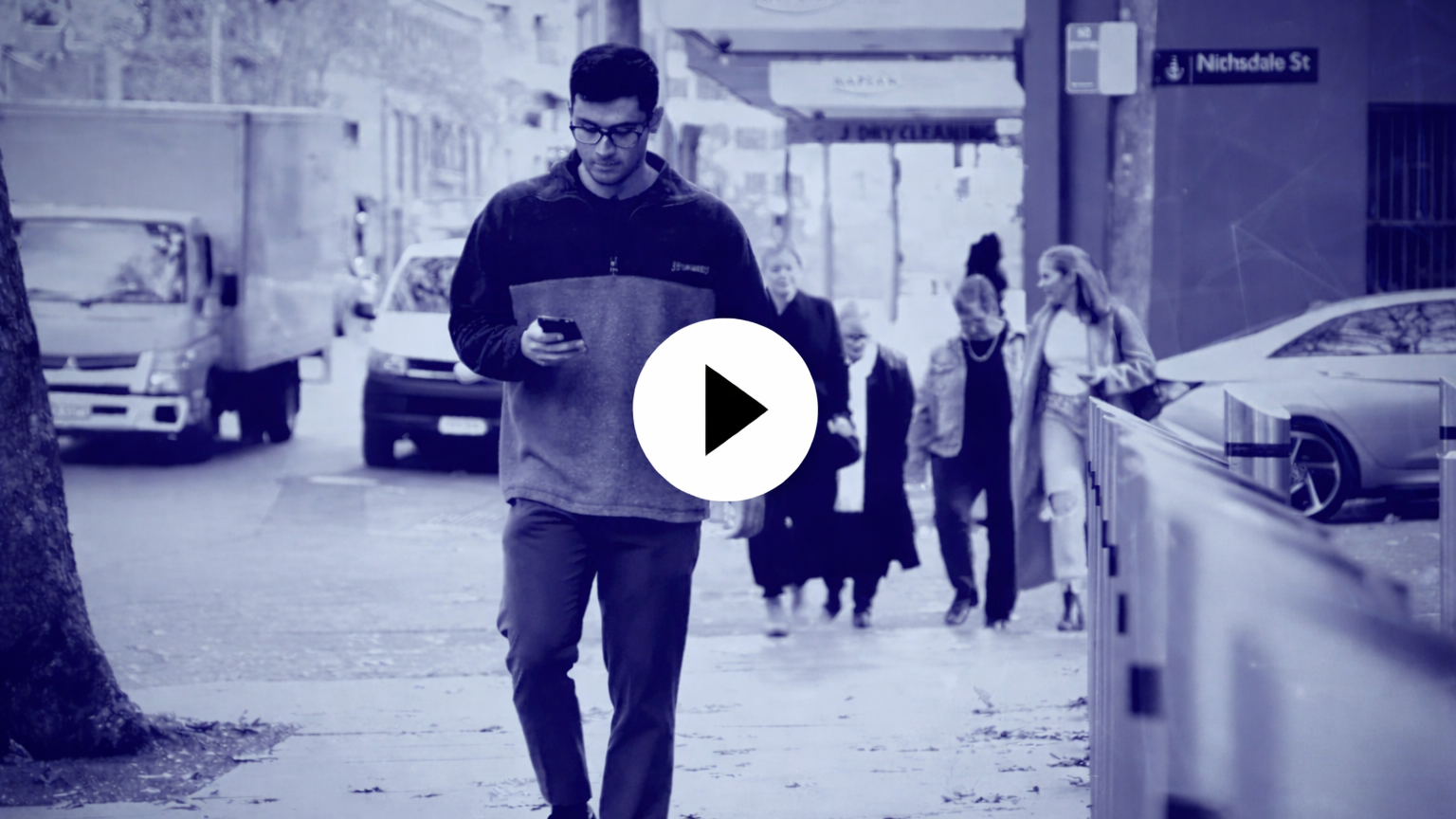 Video thumbnail for Money Muling &ndash; AFP Cybercrime Series, showing a man walking in a city street looking at his phone.