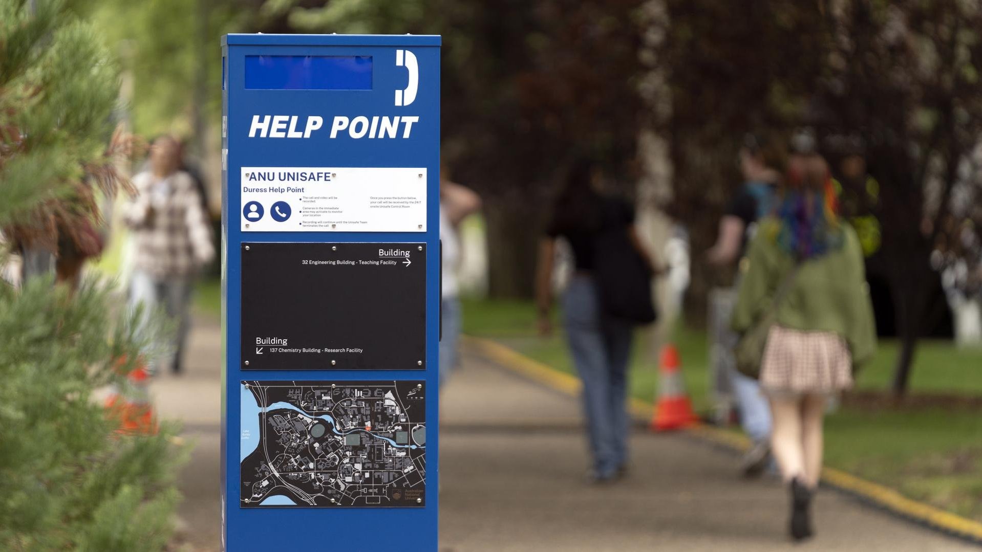 Blue Help Point on campus with map, instructions and signage.