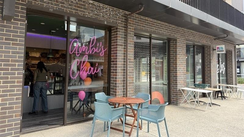 A picture showing the entrance of a coffee shop with 