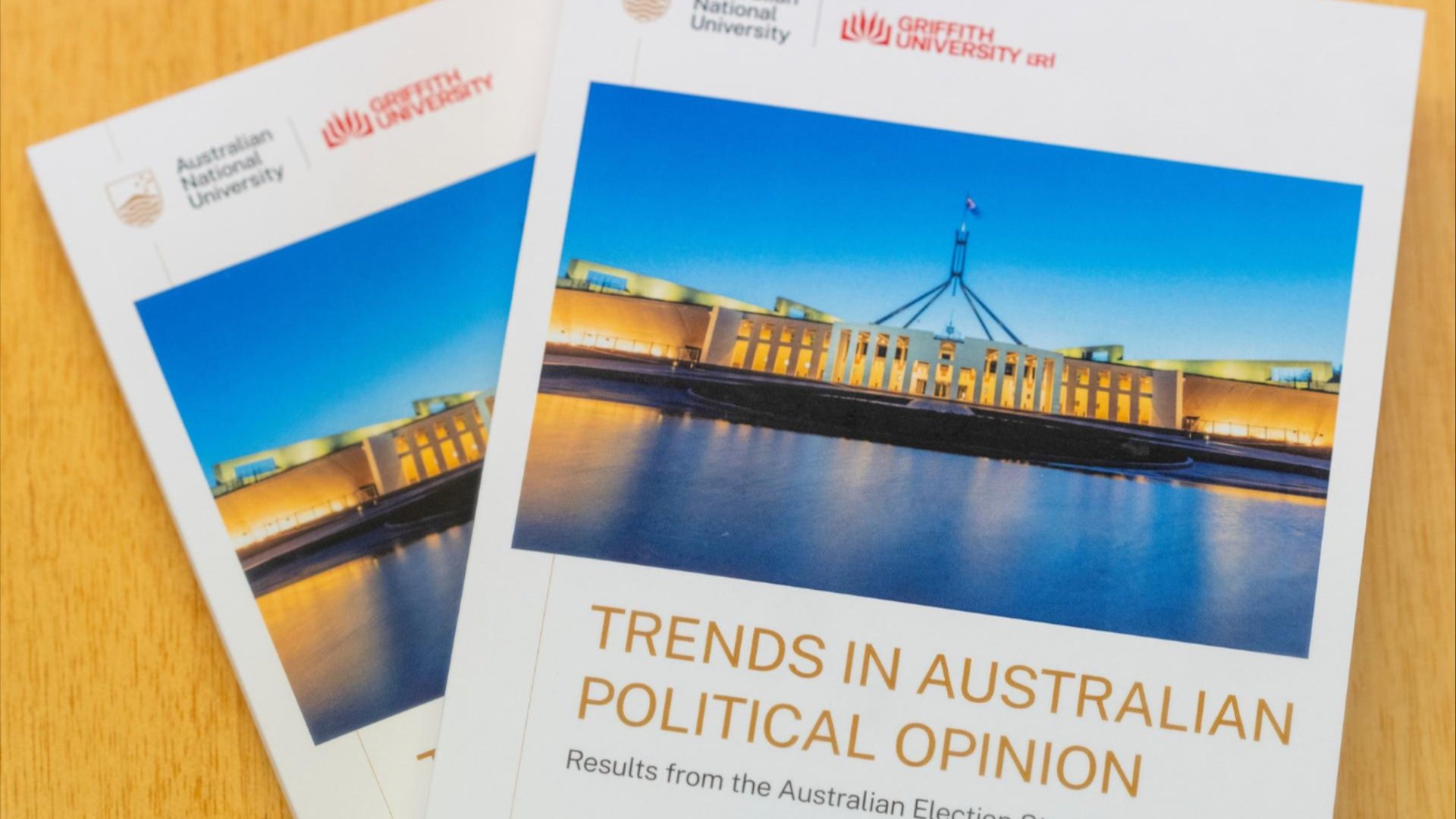 Two copies of a book titled Trends in Australian Political Opinion with a cover photo of Parliament House at dusk.