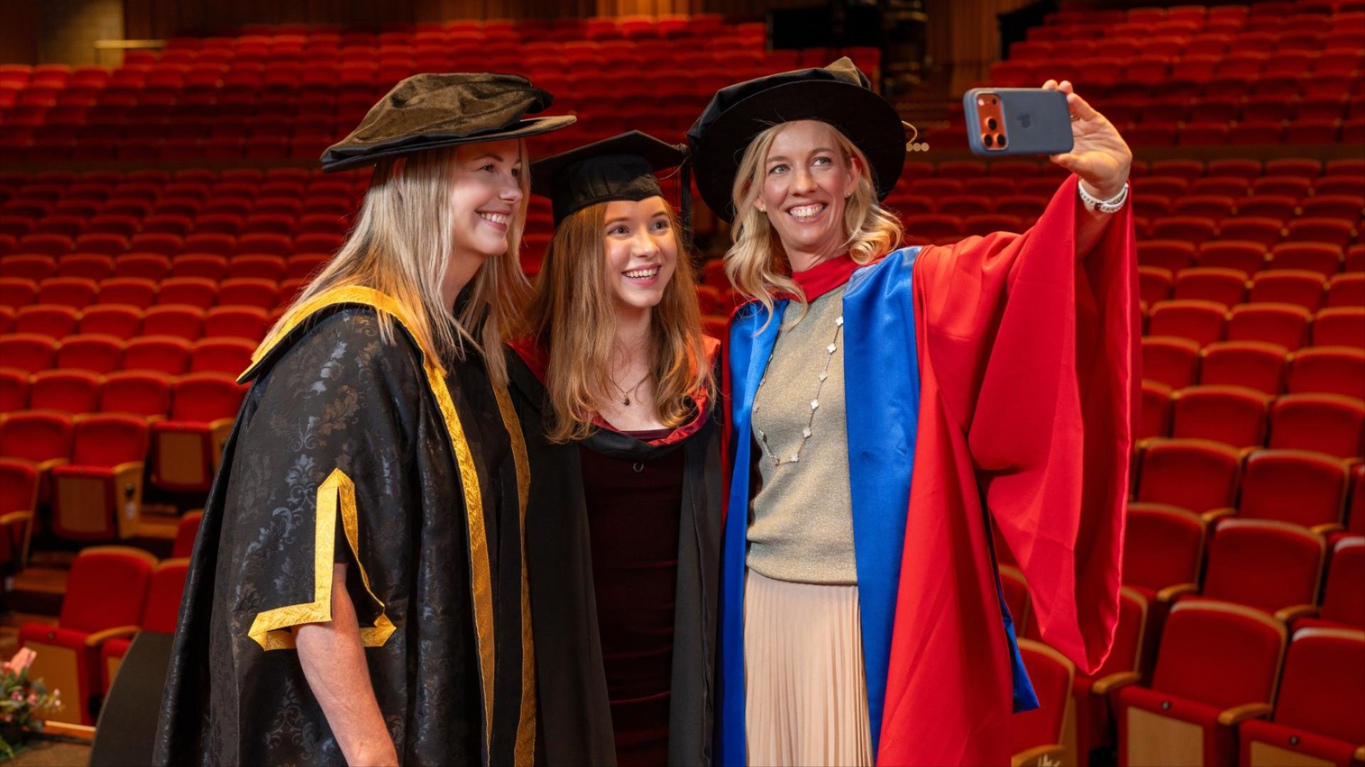 White ANU Green shuttle bus parked on campus roadway.