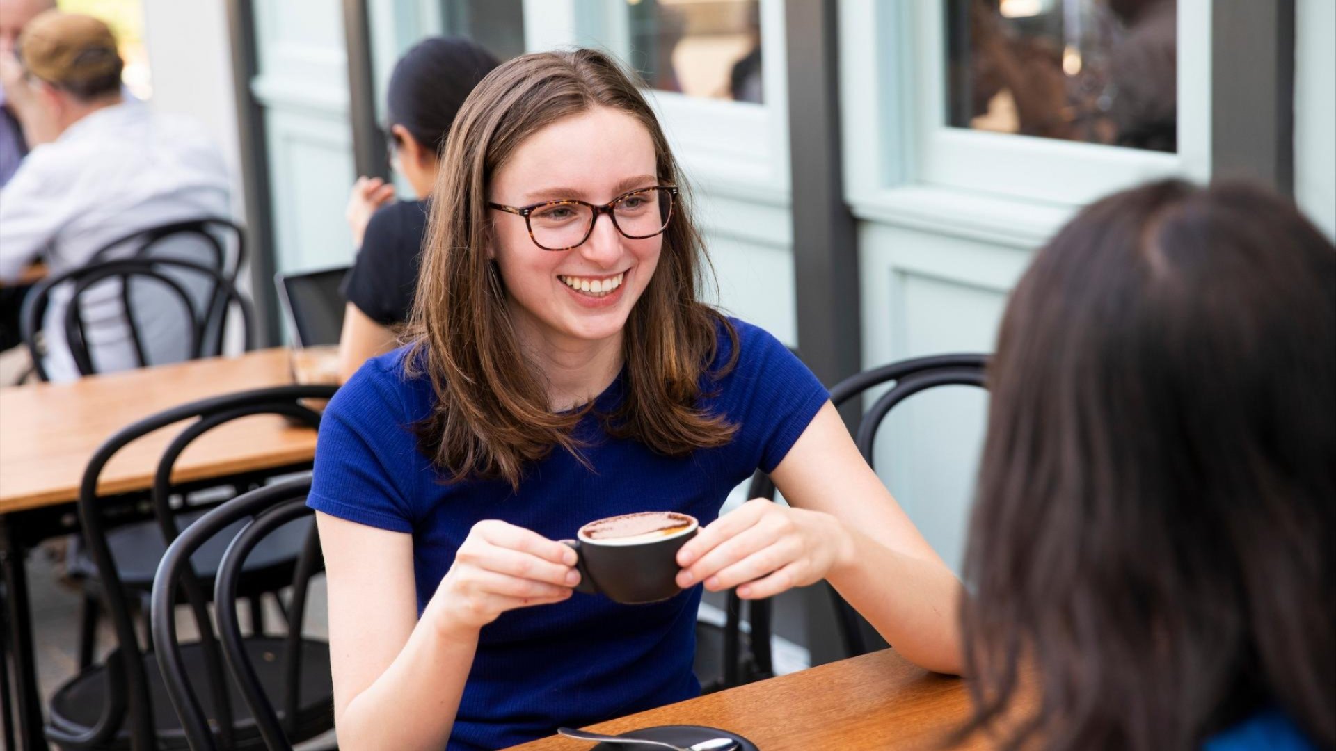 Students enjoy coffee at the Rex Espresso coffee shop in Kambri at ANU.
