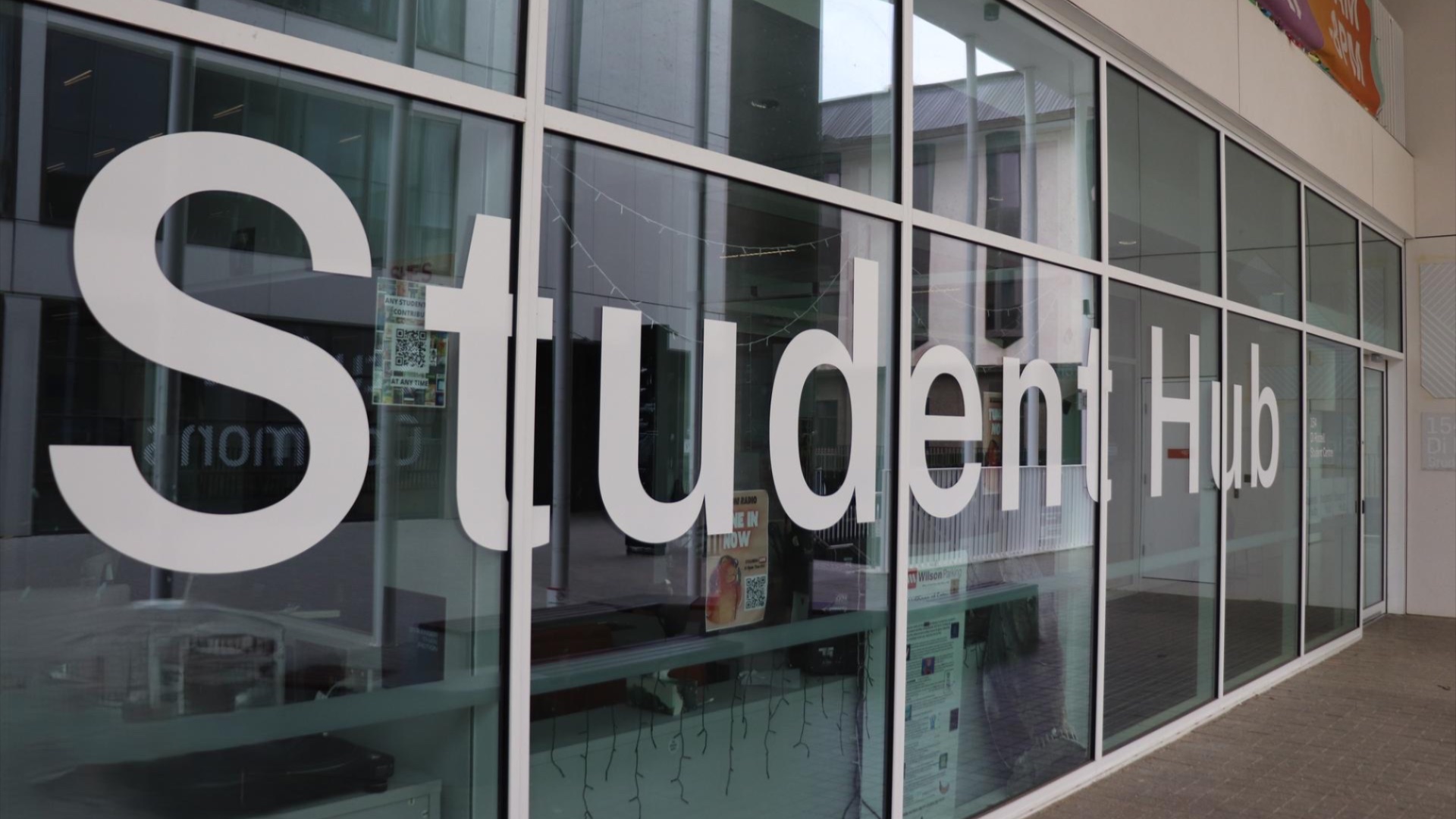 Glass windows of the ������ƵStudent Hub building. 