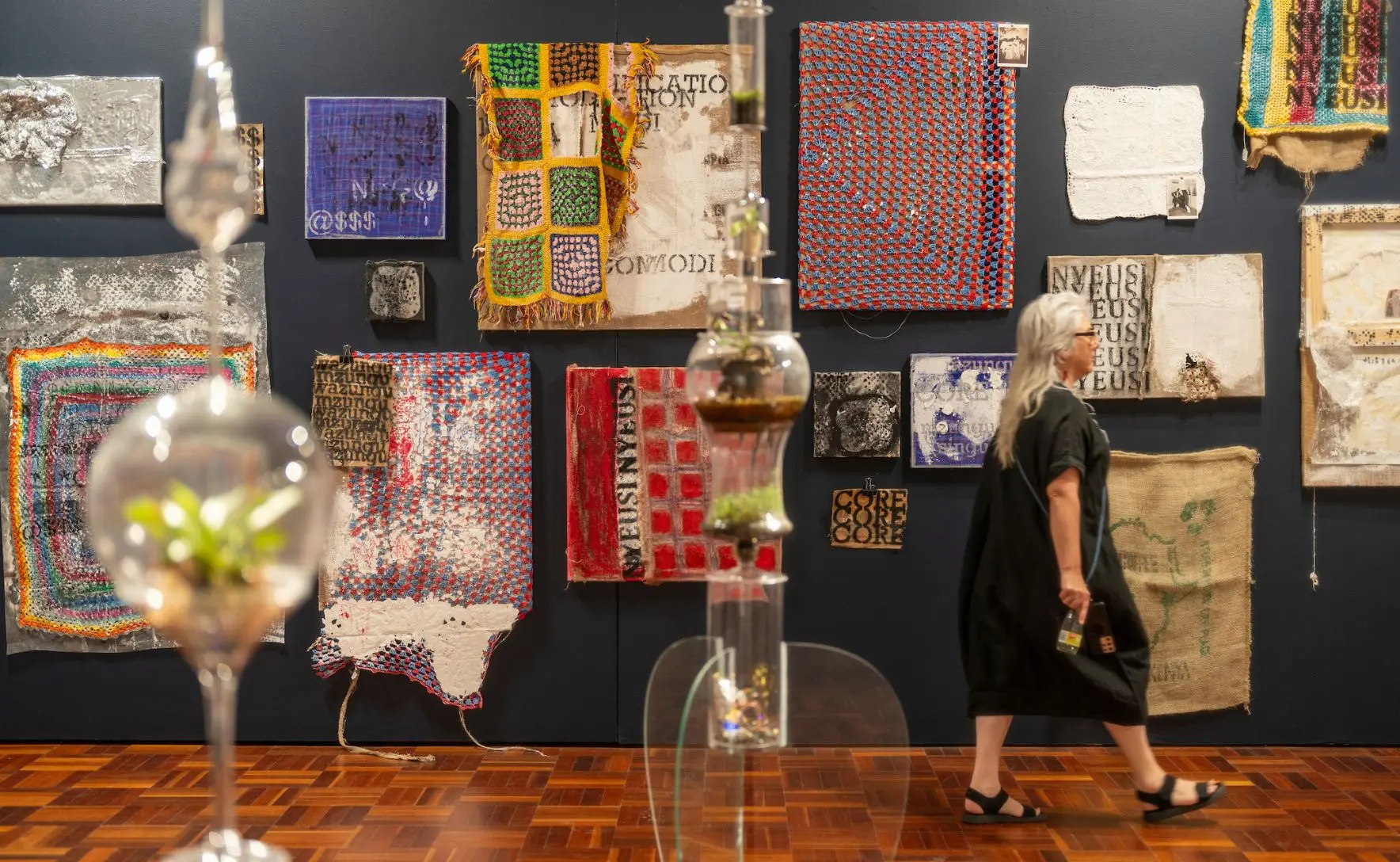 Black and white photo of the Nicol family standing together outdoors, with several adults, two children, and a baby held by an older man.