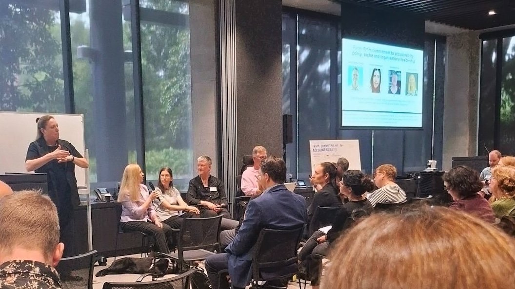 Sharon Rosenrauch speaking on a panel at a disability leadership forum, engaging with fellow panellists and audience members during a discussion on accountability and inclusive leadership.