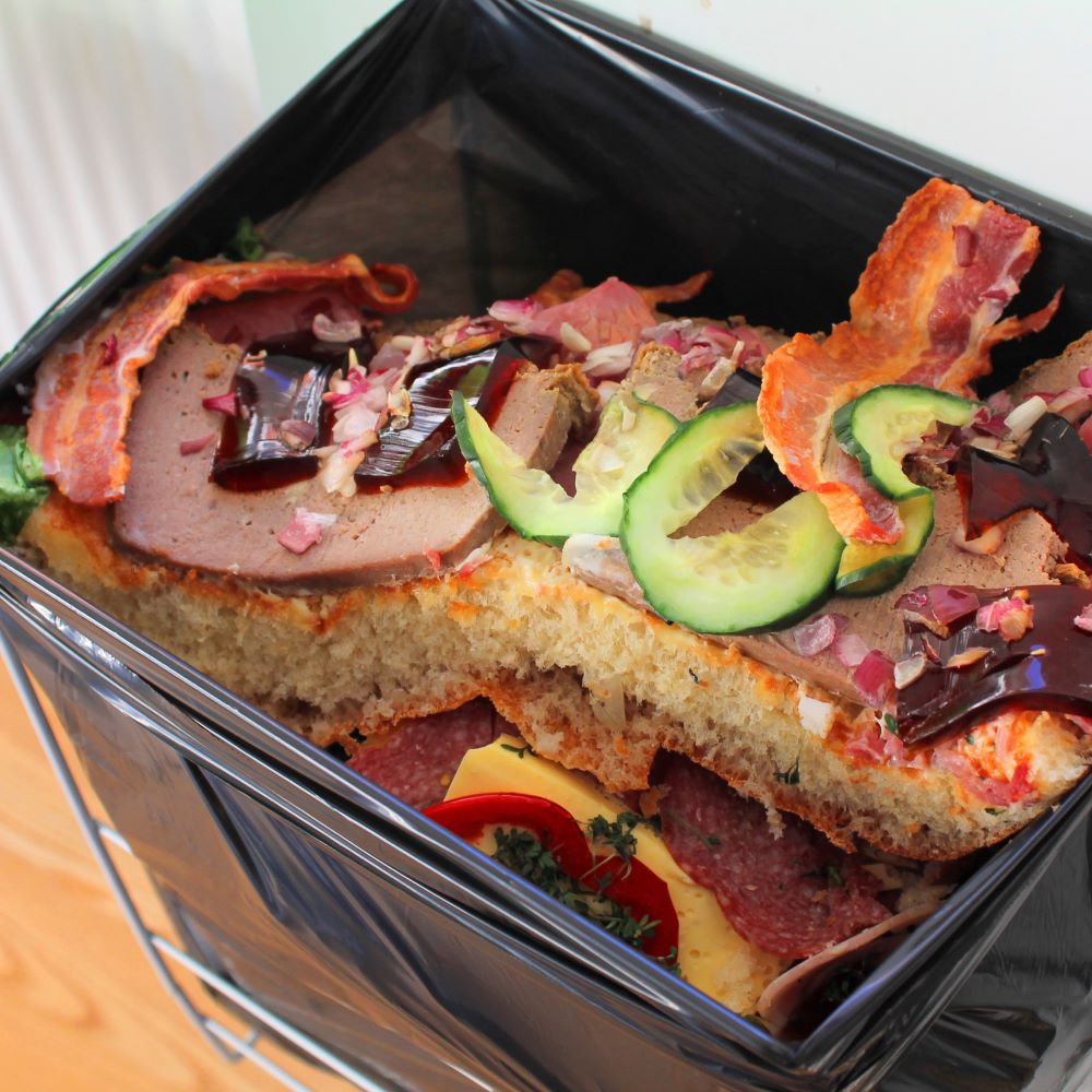 Food waste in a bin; photo from Adobe Stock.