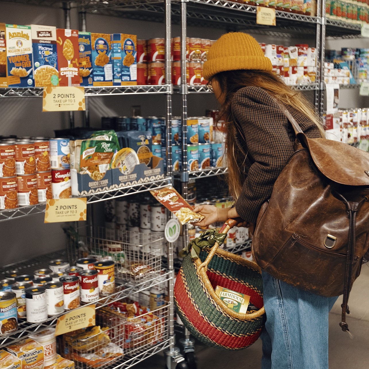Photo of a client shoppping for items at the ASI Food Pantry in January 2020.