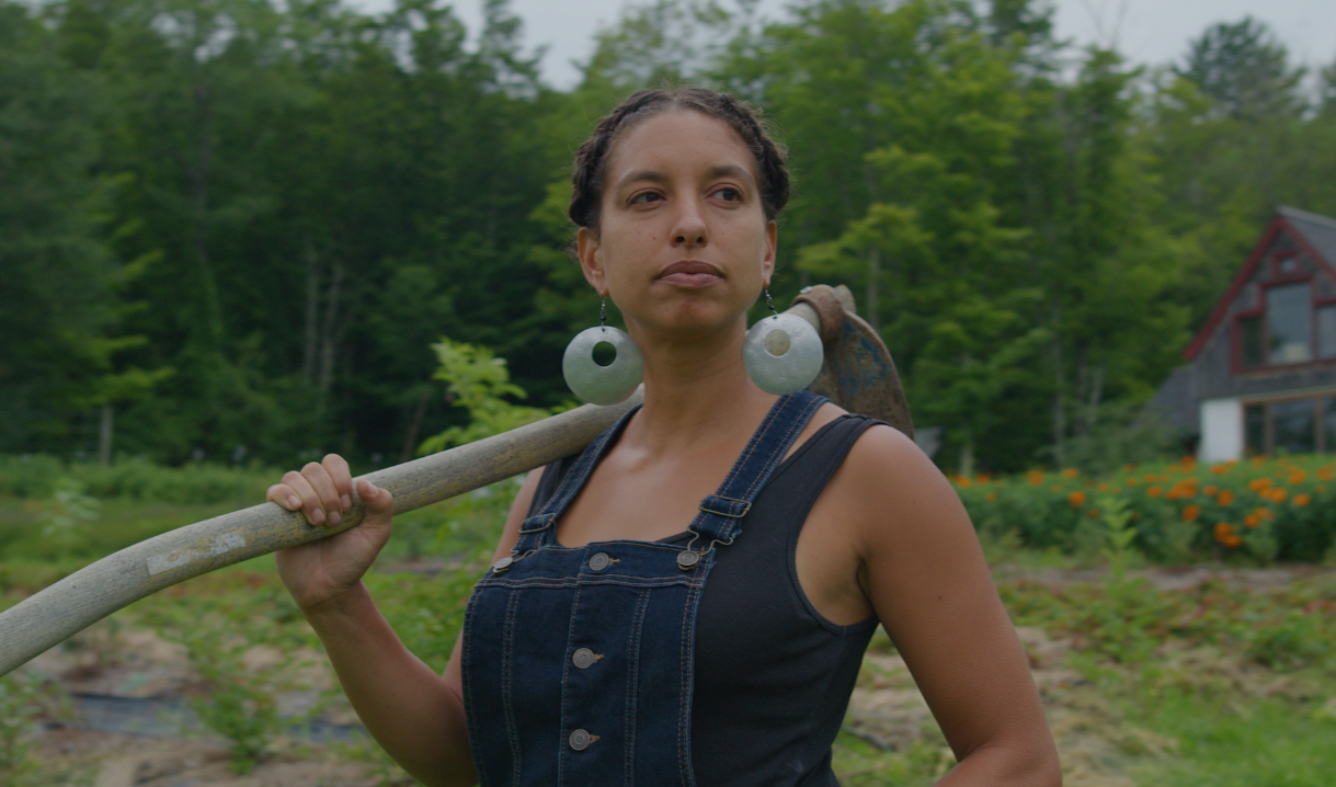 Farming While Black film still - Leah Penniman in her chicken coop. 