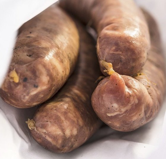 Photo of uncooked porter sausages.