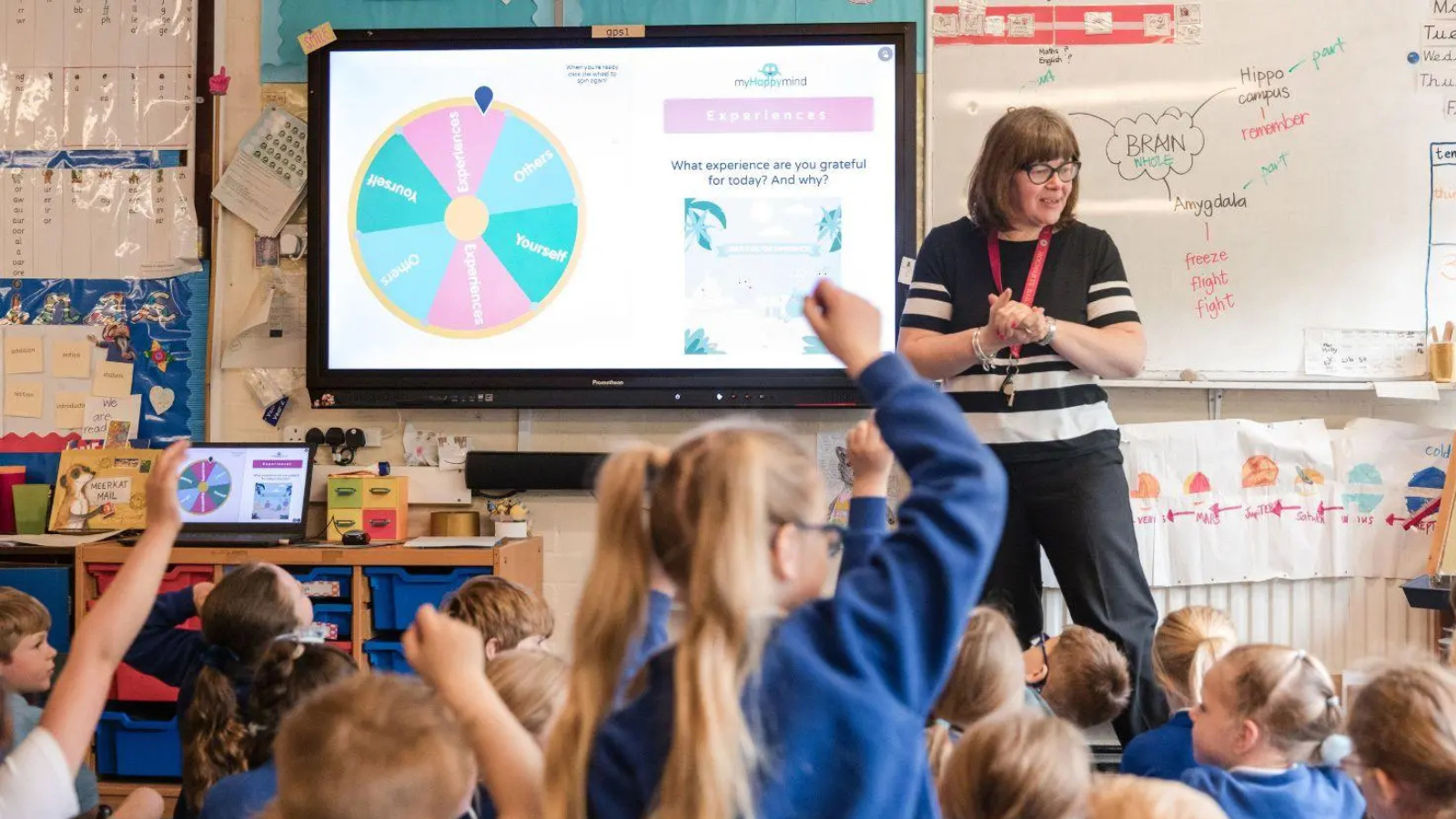 Image of a teacher in front of a class of children Image of a teacher in front of a class of children