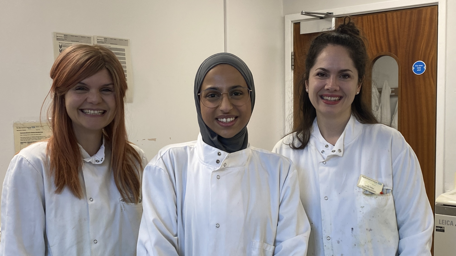 Image of three medical staff smiling