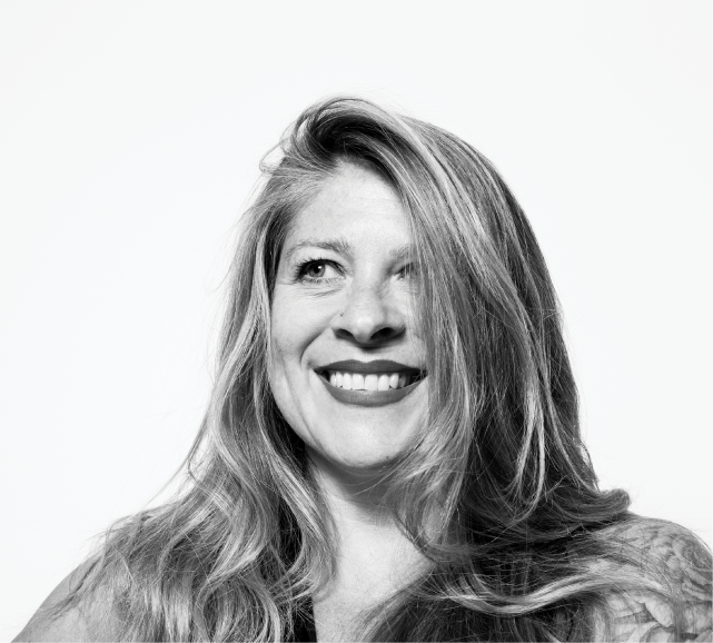 A woman smiling at the reader.