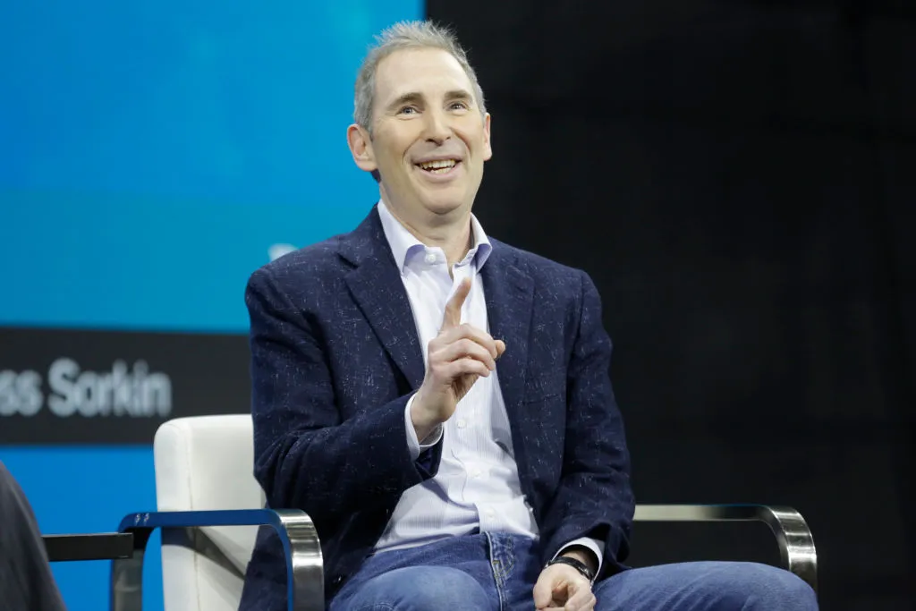 Andy Jassy in a chair onstage