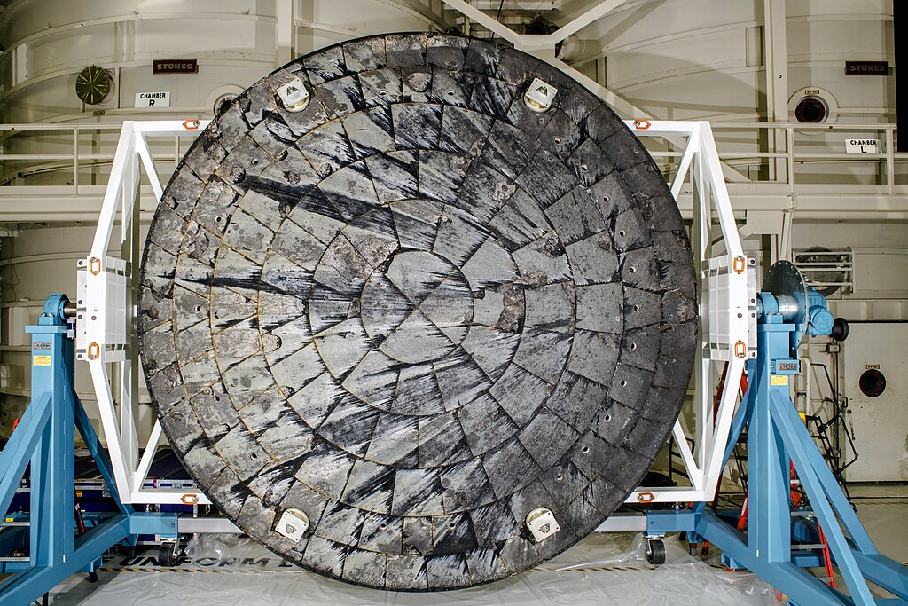 After NASA’s Orion spacecraft was recovered at the conclusion of the Artemis I test flight and transported to NASA’s Kennedy Space Center in Florida, its heat shield was removed from the crew module inside the Operations and Checkout Building and rotated for inspection. From ttps://www.nasa.gov/missions/artemis/nasa-identifies-cause-of-artemis-i-orion-heat-shield-char-loss/