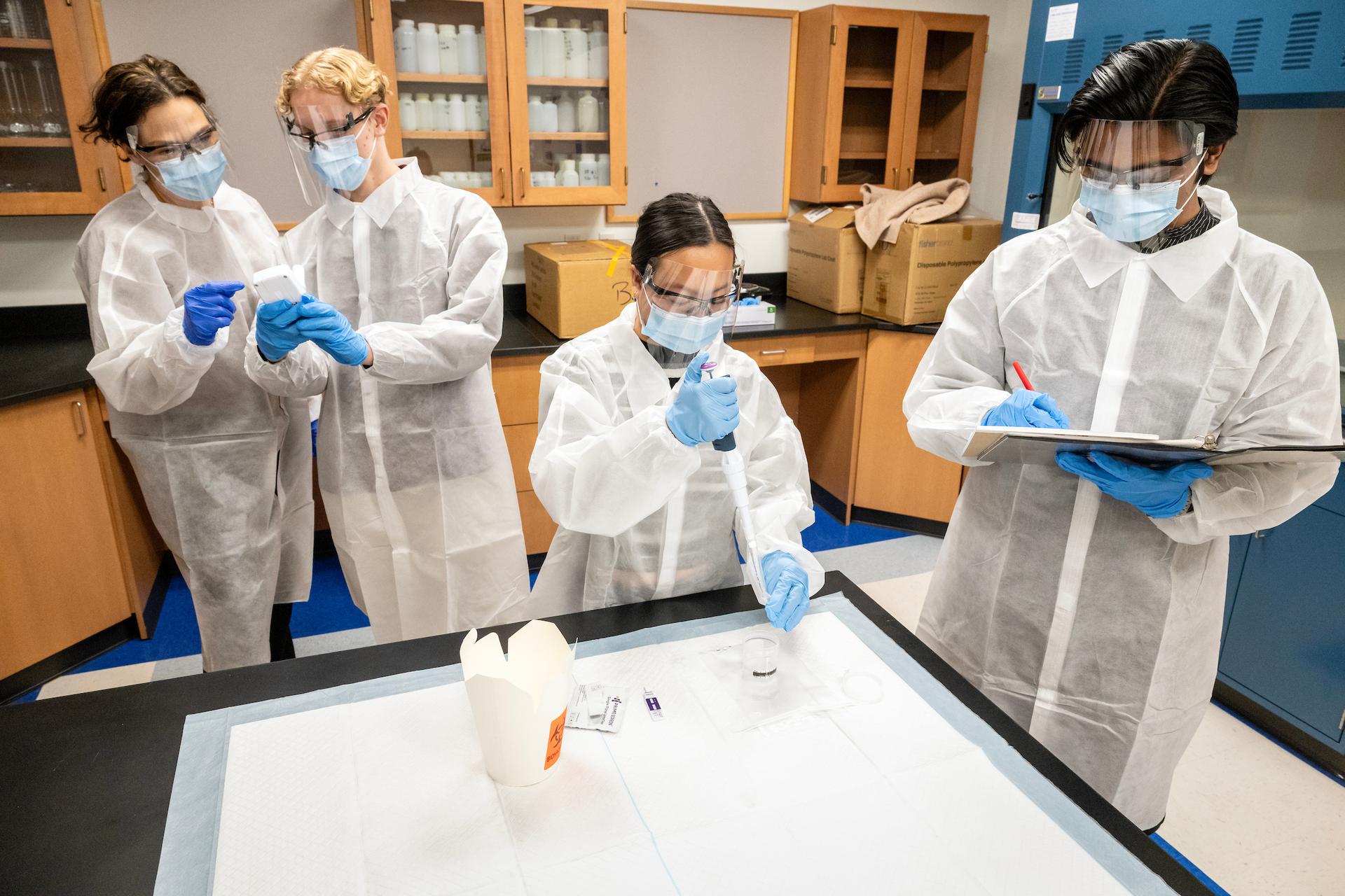 Hollie Tripp public health research with students Jocelyn Chow, Josh Anderson, & Ibrahim Bin Amjad. Pilot study of effects of cigarette warnings on smoking behavior.