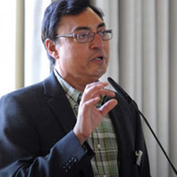CB Bhattacharya speaking at a lectern