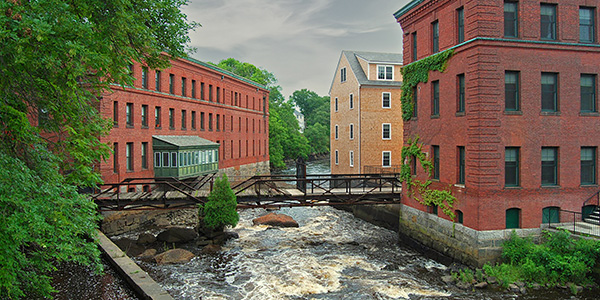 The Neponsot river, running between buildings.