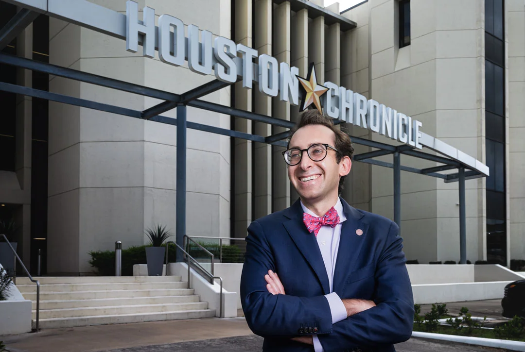 Evan Mintz standing outside the Houston Chronicle building