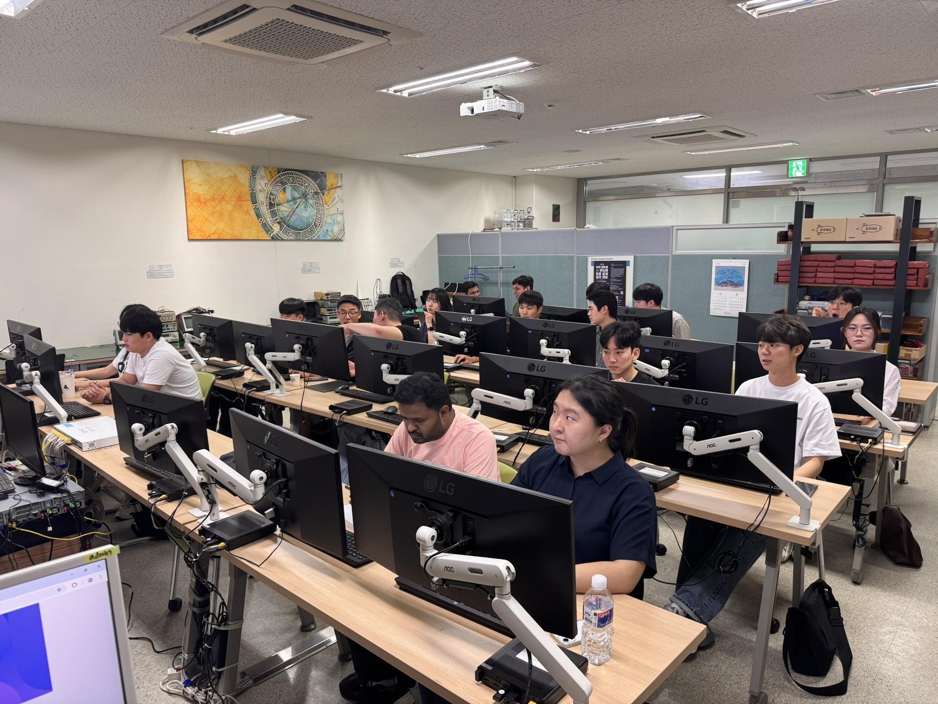 a group of people working on laptops