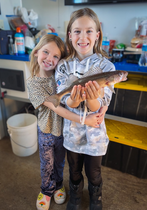 kids holding fish