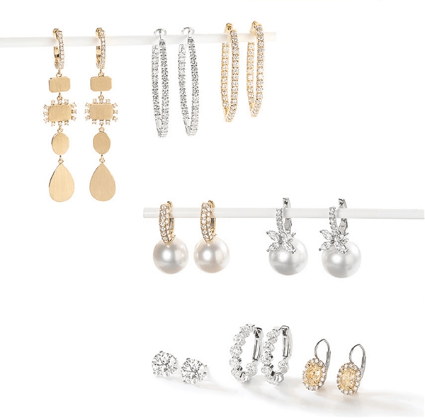 Pairs of gold and silver earrings with diamonds and pearls