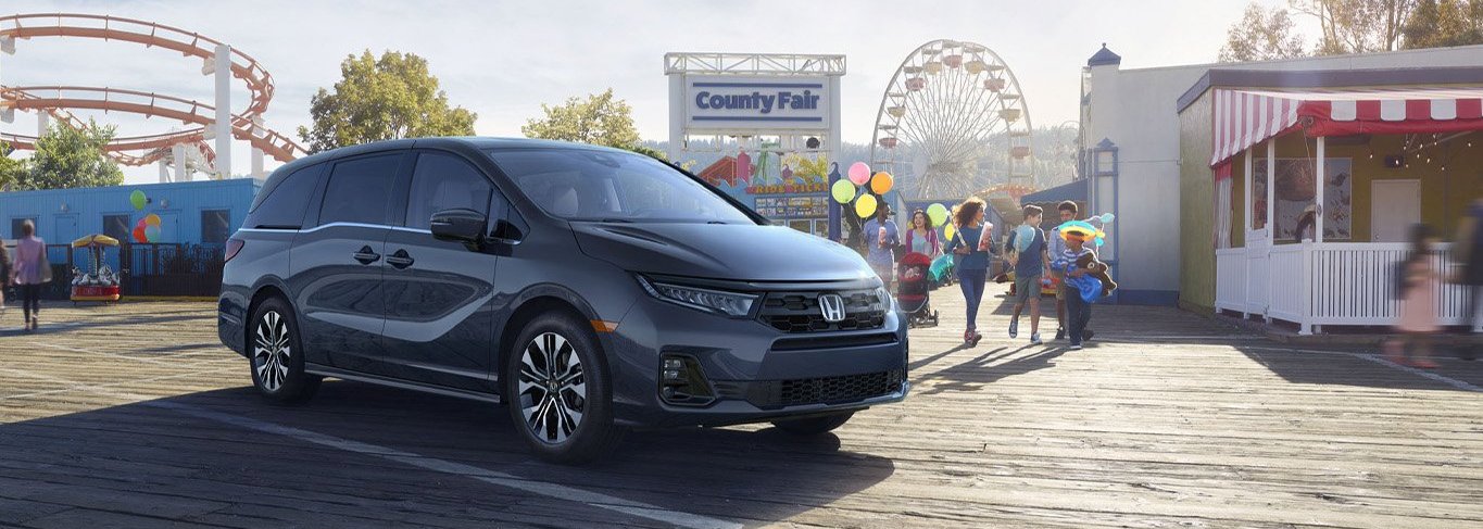 New 2026 Honda Odyssey at Delaney Honda | 2026 Honda Odyssey parked by a county fair