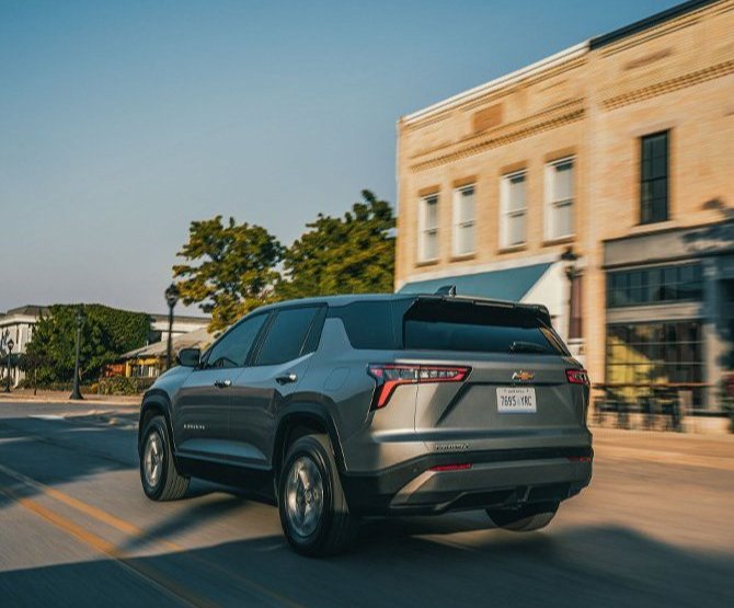 2026 Chevrolet Equinox at Delaney Chevrolet of Indiana | Rear profile of a 2026 Chevrolet Equinox driving down the street
