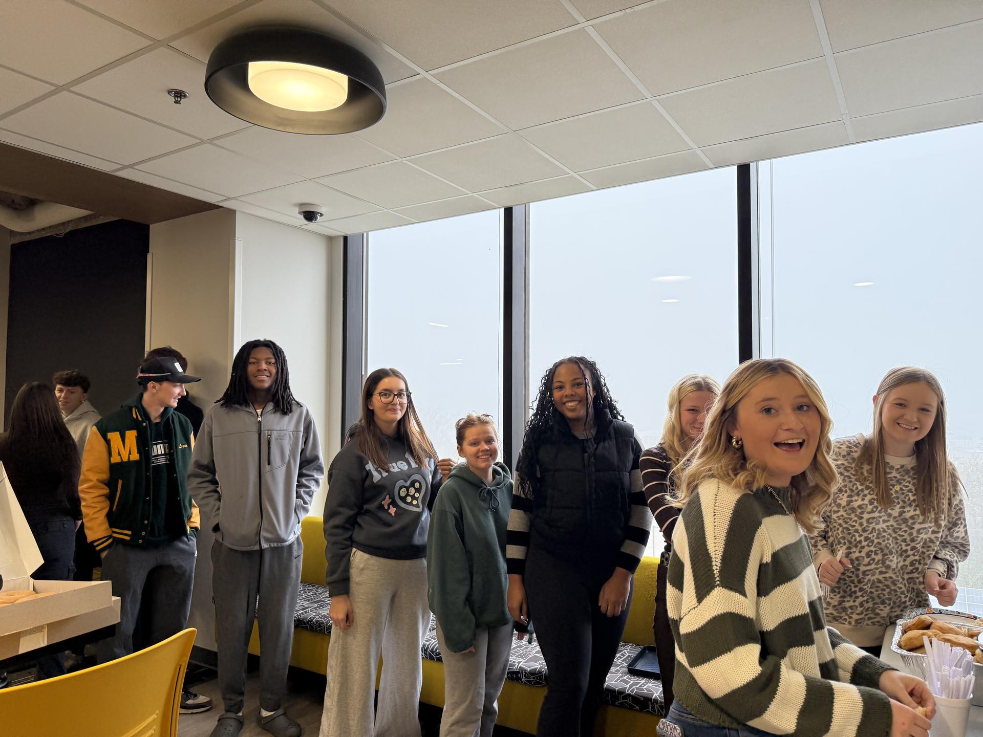 Picture of LIFT Leadership alumni lunch - students & alum in line to eat