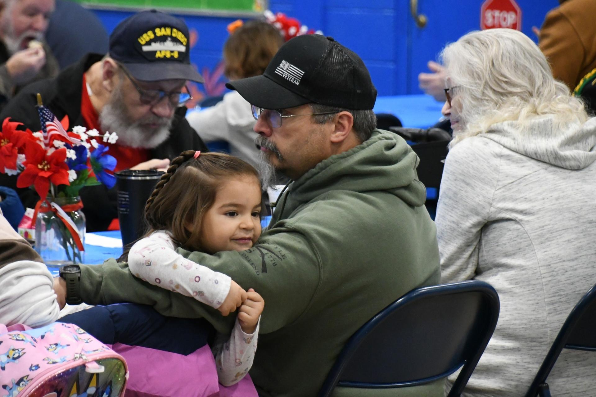Picture of Veterans Day School Celebrations - student with a veteran