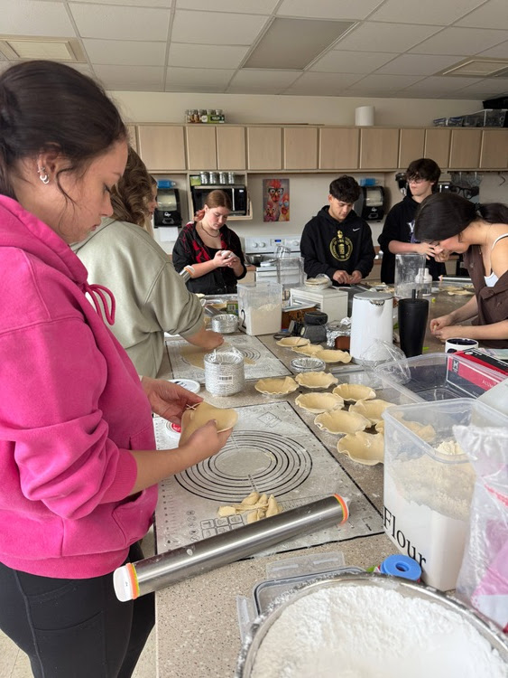 Picture of MHS Food Science students making homemade pies and pumpkin rolls