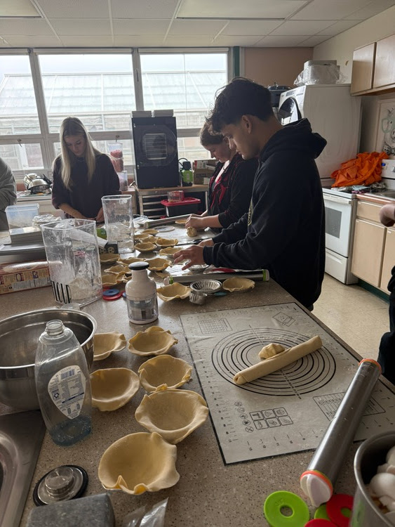 Picture of MHS Food Science students making homemade pies and pumpkin rolls