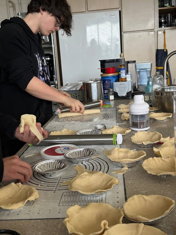 Picture of MHS Food Science students making homemade pies and pumpkin rolls