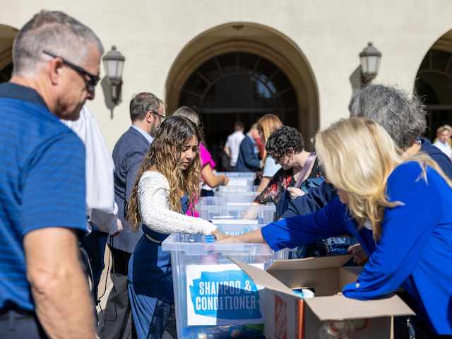 Volunteers packing boxes at USD community service event