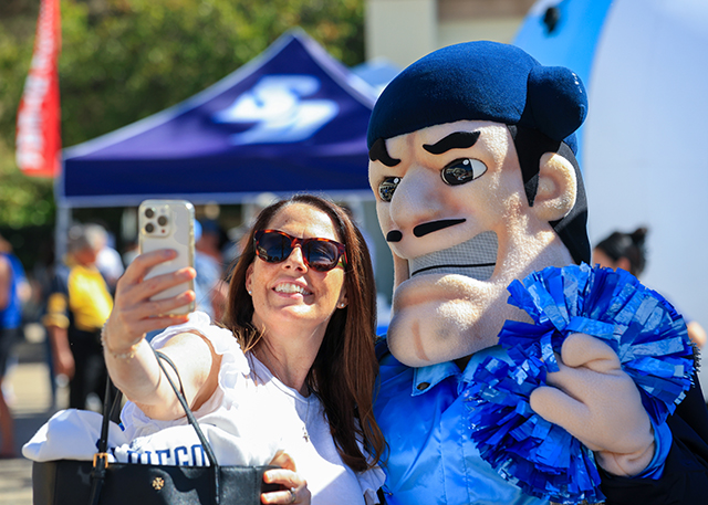 Woman with Diego during the Torero Tailgate