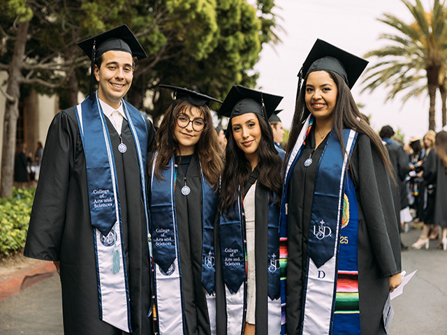 USD Grads smile for the camera