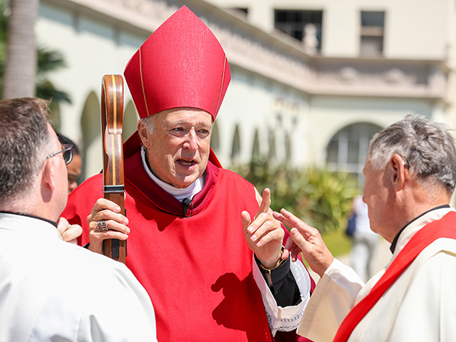 Cardinal McElroy talks to priests outside The Immaculata