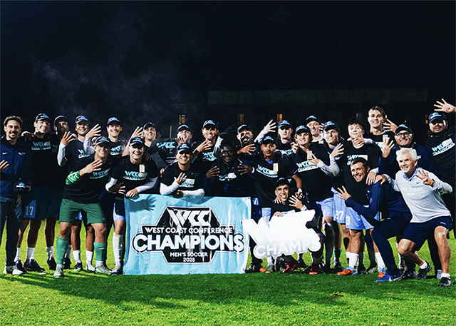 Men's soccer team photo with banner