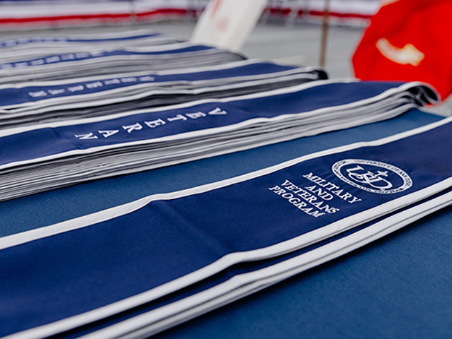 Military and Veterans program stoles on a table. 