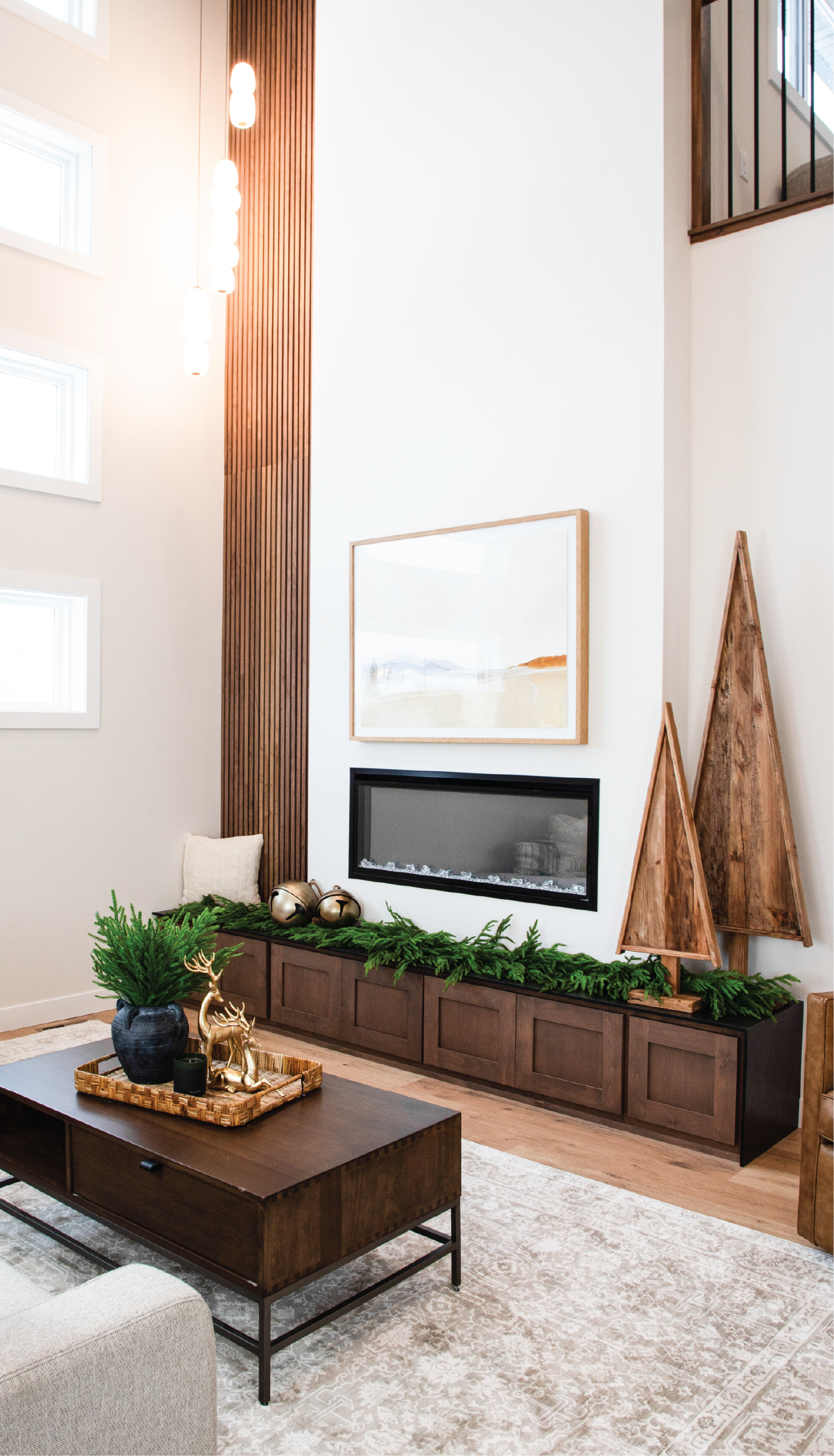 a tree with green leaves and chairs in a room with a staircase a tree with green leaves and chairs in a room with a staircase