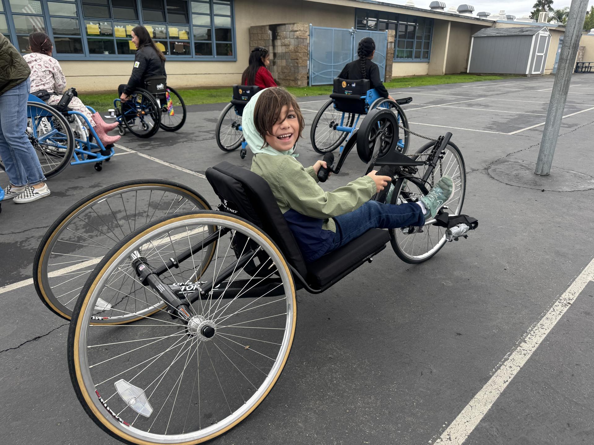 Student learns how to handcycle. 