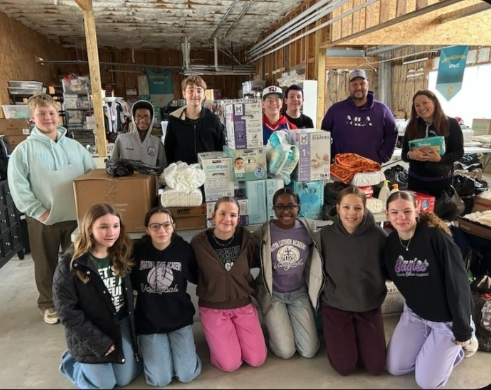 Students from Martin Luther Academy surrounded by diaper donation