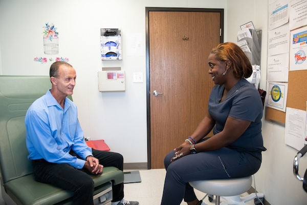 Matt Shotwell chats with Ritter Center's lead medical assistant NuBeing Dearborne Andi Hatch