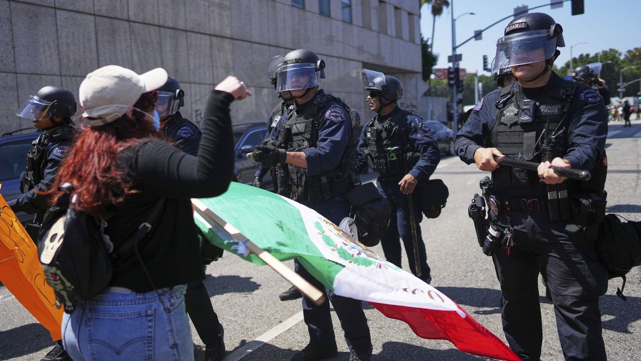 Protesters clash with police in Los Angeles, Sunday, June 8, 2025, following last night's immigration raid protest. [AP Photo/Eric Thayer]
