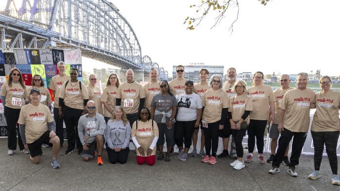 a group of people posing for a photo at Walk Ahead event