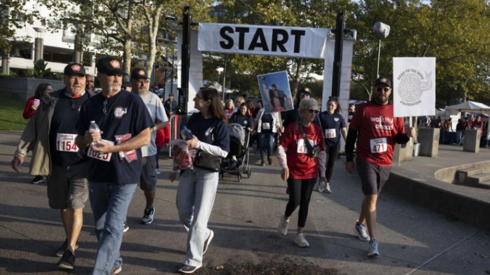 a group of people running at Walk Ahead event