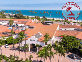 a pool with a deck chair and umbrella
