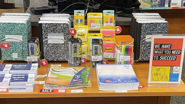 A display of office supplies with a sign that reads “We have what you need to succeed.”