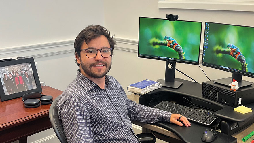 Noah Stern sitting at his office computer.
