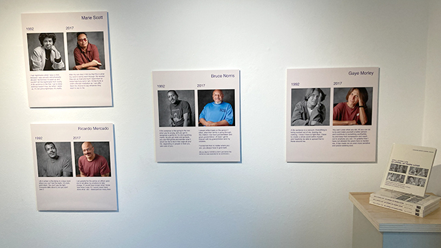An art display featuring four side-by-side portraits and bios of Pennsylvania inmates on a white wall.